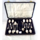 A cased set of twelve silver coffee spoons and pair of sugar tongs to match, all with decorative