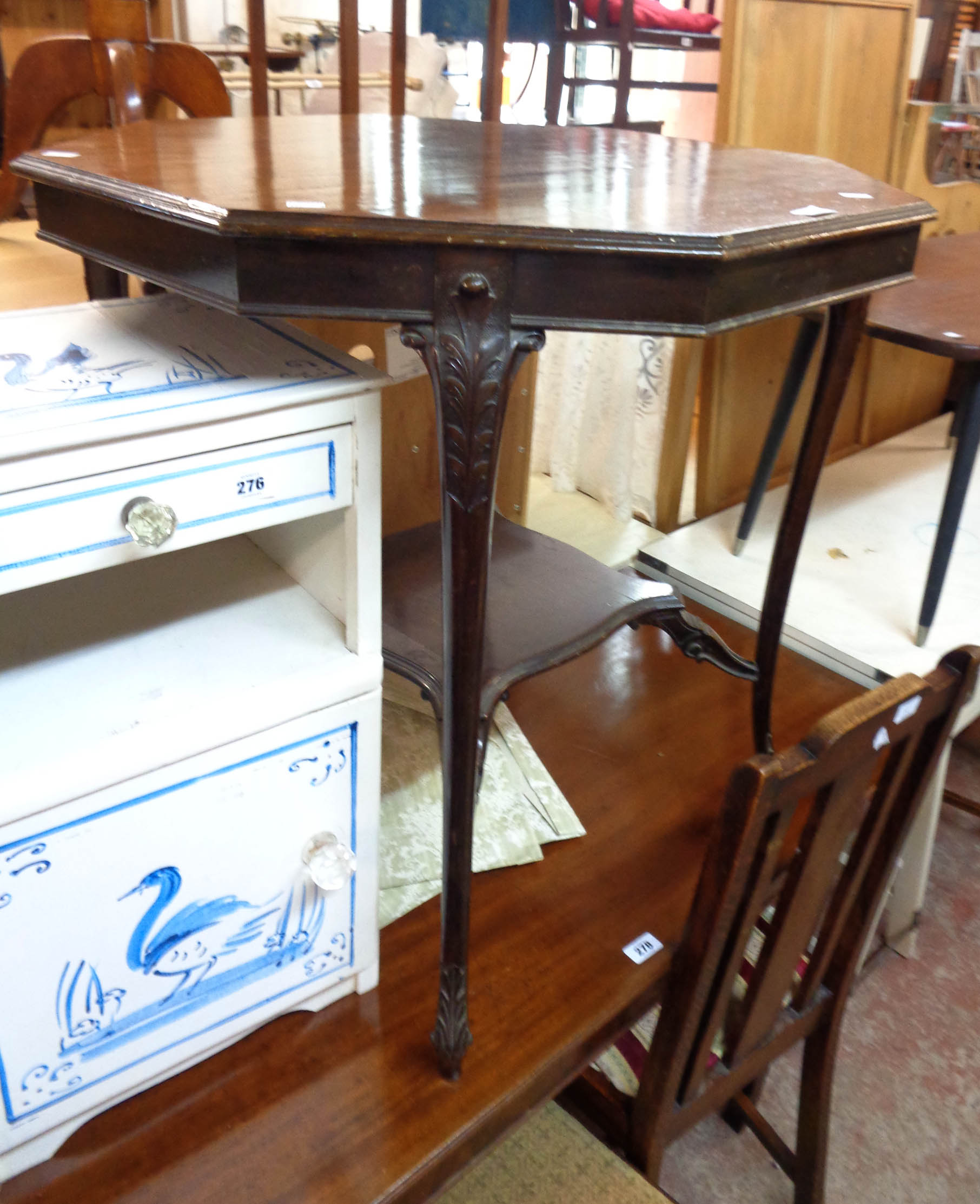 A 73cm Edwardian mahogany octagonal top centre table, set on decorated cabriole supports with