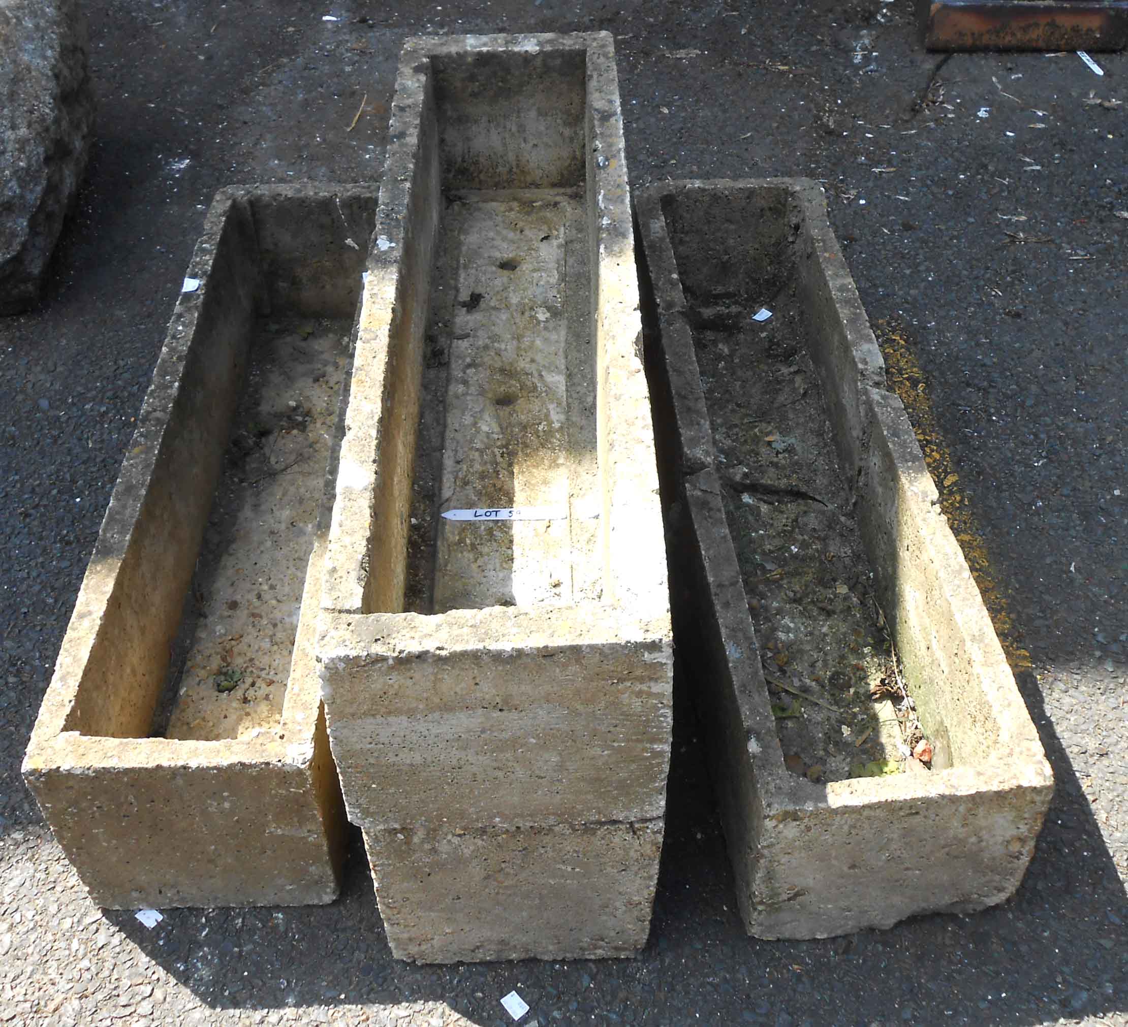 Three concrete trough form garden planters - sold with another example, cracked in two