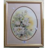 Bonia Rush: a gilt framed still life study of roses - signed, in oval mount