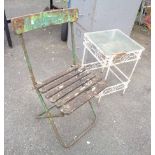 A metal and wood folding garden chair with remains of original paint - sold with a glass topped