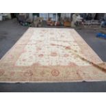 A large handmade Pakistani carpet with typical pattern in a muted brown palette - 5.34m x 2.71m -