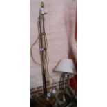 A modern brass uplighter floor lamp - sold with a matching table lamp