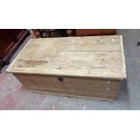 A 1.17m antique stripped pine lift-top chest with internal candle box and original escutcheon and