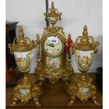 A vintage ornate cast brass and porcelain style clock garniture, the clock with German floating