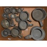 A selection of antique and later pewter measures and tankards