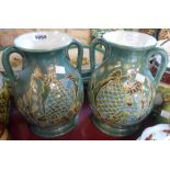 A pair of modern art pottery vases decorated with sgrafitto fish designs