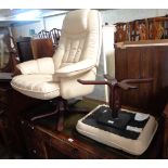 A modern cream leather upholstered easy chair and foot stool to match, both set on stained