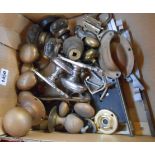 A box of assorted vintage door handles and fittings including glass, brass and chrome examples