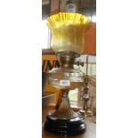 A Victorian burner oil lamp with Hinks twin burner and clear glass faceted reservoir on brass