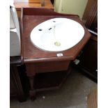 An 87cm Victorian style corner washstand basin with turned supports and shaped undertier