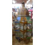 A large Moroccan style stained glass and brass hanging ceiling lantern