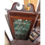 A 67cm antique oak corner cabinet with swan neck pediment and shelves enclosed by a beaded glazed