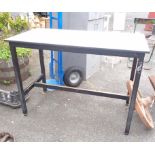 A vintage school science table with formica top and painted metal base