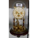 A vintage Prescott rose decorated anniversary clock with ball pendulum under glass dome