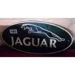 A modern cast metal painted Jaguar car sign