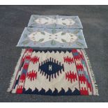 A 20th Century Pakistan kelim with repeat geometric designs on a cream ground - sold with two
