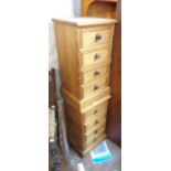 A pair of modern pine four drawer bedside chests
