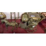 A large vintage cast brass model of a horse and carriage