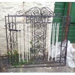 A pair of wrought iron garden gates