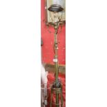 A late 19th Century telescopic brass lamp standard in the Art Nouveau style with applied copper