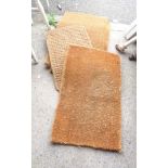 Four coir doormats of various style