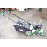 A Briggs and Stratton The Handy petrol lawn mower