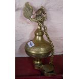 A modern Eastern brass hanging oil lamp