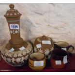 A Doulton Lambeth Silicon stoneware bottle and cover decorated with applied cherub frieze - sold