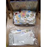 A tin containing 20th Century stamps on paper - sold with others and several FDCs - various