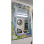 A decorative painted wood framed oblong wall mirror with heart decoration