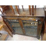 A 96cm 20th Century oak book cabinet enclosed by leaded glazed panel doors - 1 a/f