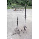 A wrought iron adjustable flower holder - sold with a similar wrought iron stand
