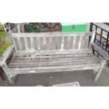 A teak slat back garden bench - tired and worn condition
