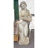 A life size resin statue of a classical maiden