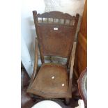 A late 19th Century continental stained mixed wood nursing chair with remains machine pressed