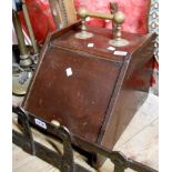 A wooden coal box with brass handle and associated shovel