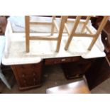 A 1.23m Victorian mahogany washstand with shaped marble splashback top, central frieze drawer and