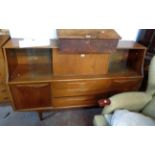 A 1.7m retro teak effect sideboard, in the Jentique style, with central fall front drinks