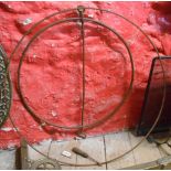 Two antique children's play hoops - one with wrought iron handle, the other with wooden handle