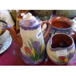 Four pieces of Longpark Torquay pottery decorated in the crocus and Alexandria rose pattern