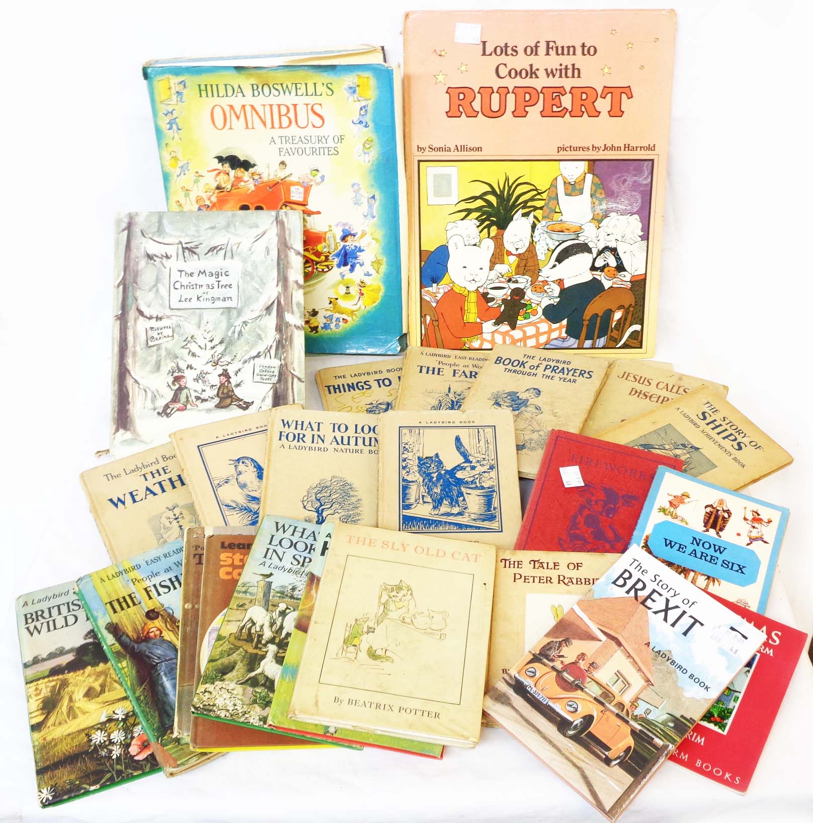 A collection of vintage childrens' titles including Ladybird readers with buff covers, etc.