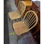 Two similar vintage hoop stick back kitchen chairs, both with solid elm moulded seats, set on turned