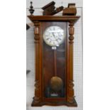 An early 20th Century walnut cased Vienna regulator style wall clock with Gustav Becker twin
