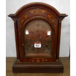 A late 19th Century German inlaid walnut cased break dome top table clock with arched copper dial