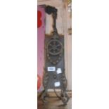 A cast iron table lamp of upright rectangular form with applied acanthus leaf and wheel decoration