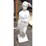 A modern plastic garden water feature in the form of a classical maiden holding an urn