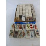 A box containing a large collection of sets and parts set of cigarette cards including John Player
