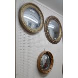 Three decorative antique style gilt plaster framed convex wall mirrors