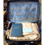 A suitcase containing assorted ephemera including 20th Century postcards and various copies of The